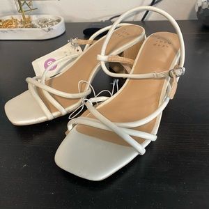 White strappy heeled sandals